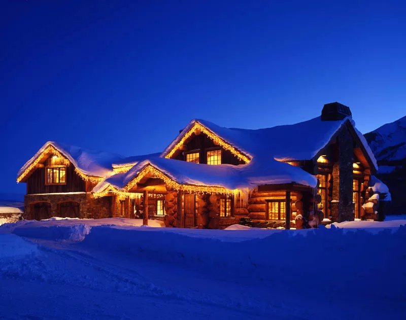 Red Feather Ranch custom log home in Crested Butte exterior winter log home